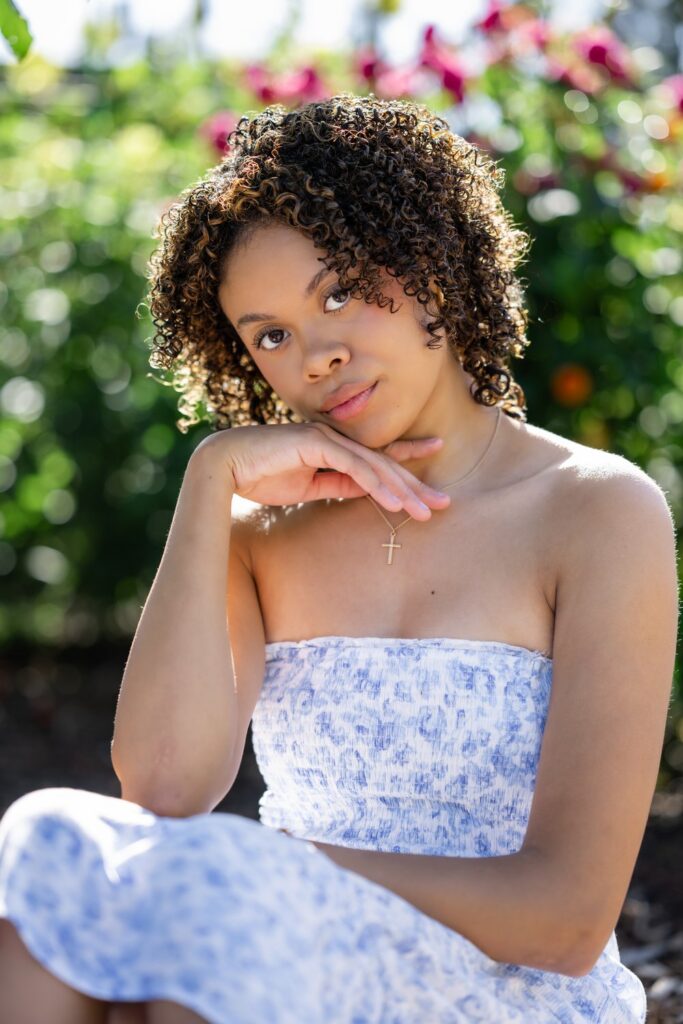 senior girl blue dress flower farm sitting