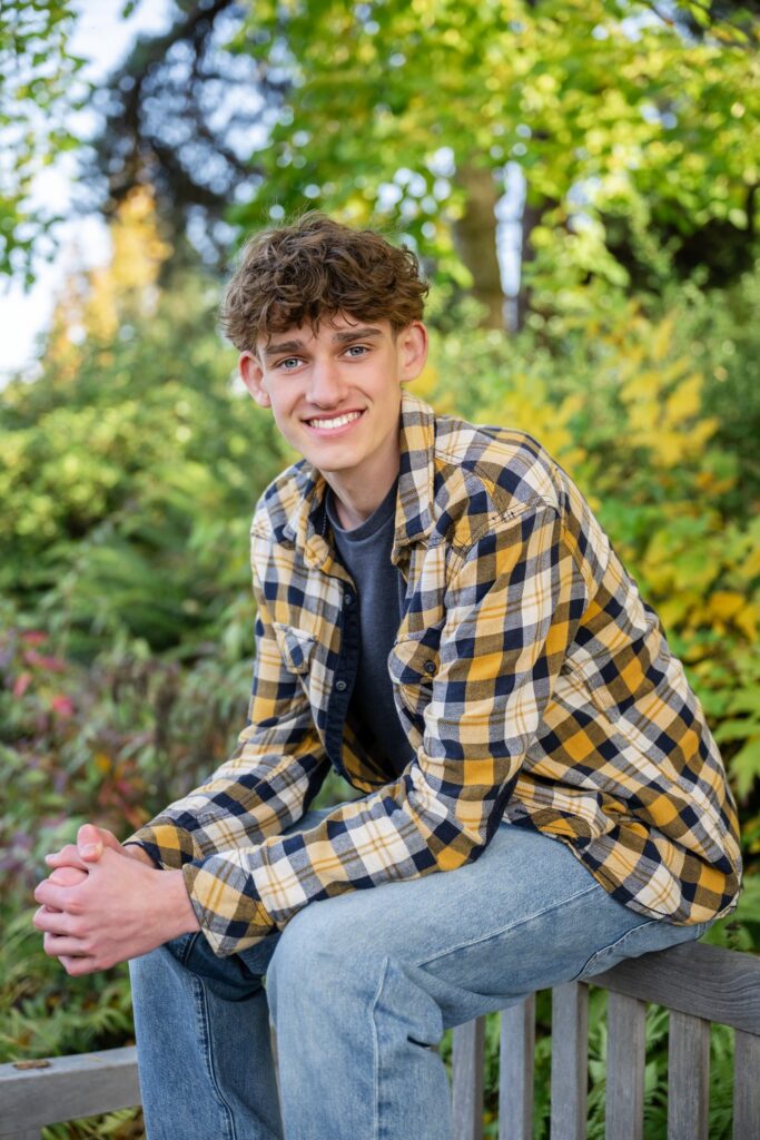high school senior boy at bellevue botanical garden in fall