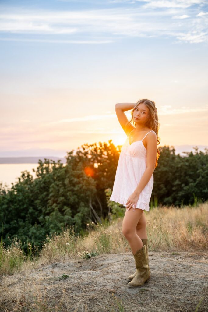 senior girl sunset at discovery park bluff seattle