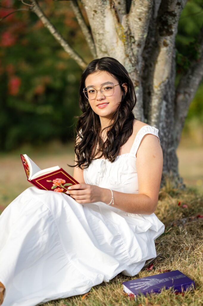 high school girl with books at discovery park