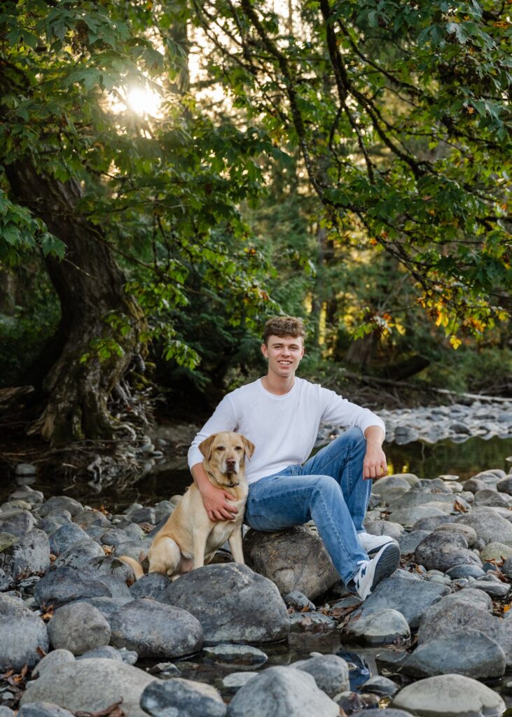 senior guy with dog at river park