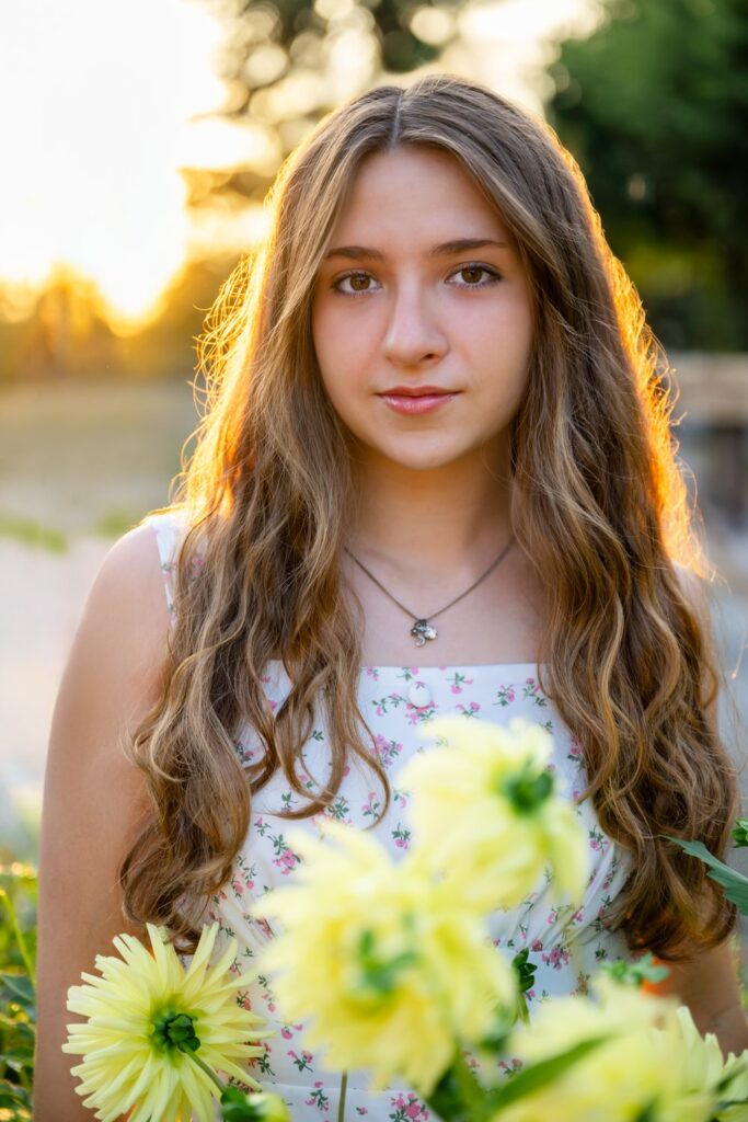 senior girl sunset dahlia flowers