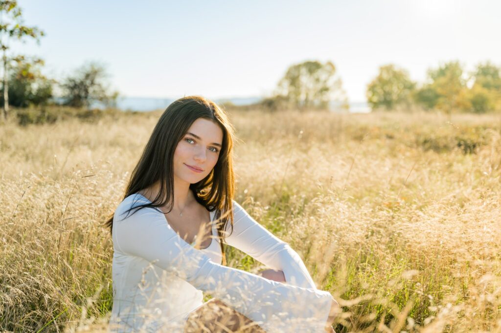 tall grass seated senior picture seattle park