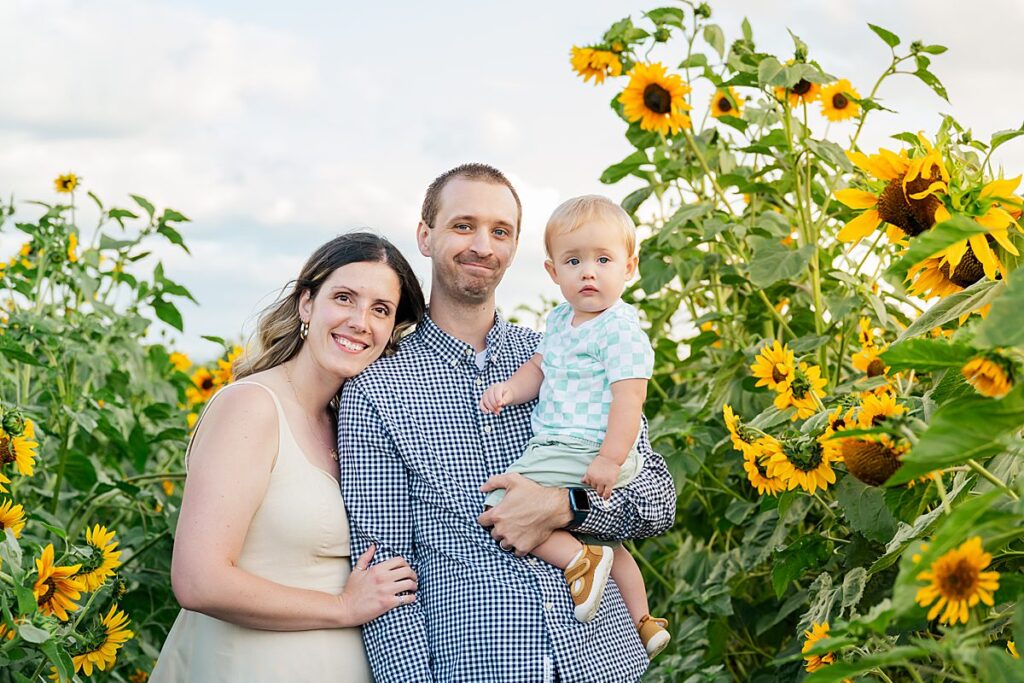family at sunflower patch with baby