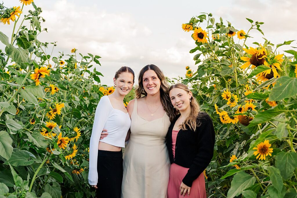 young women sunflower field