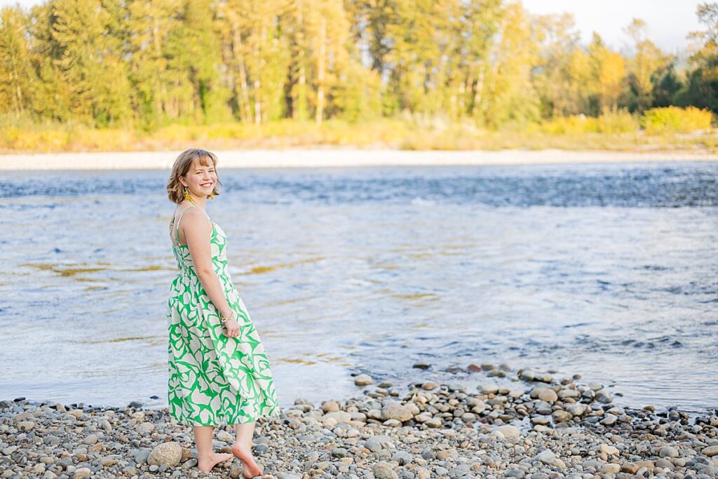 girl at river in green dress
