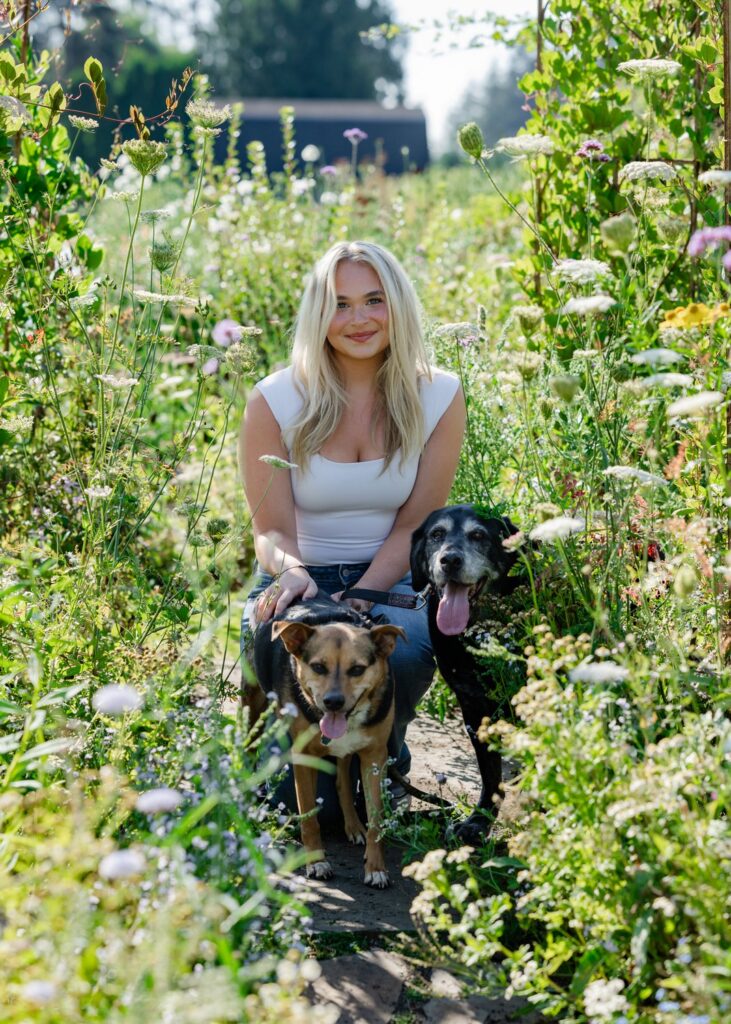 garden senior portrait with dogs