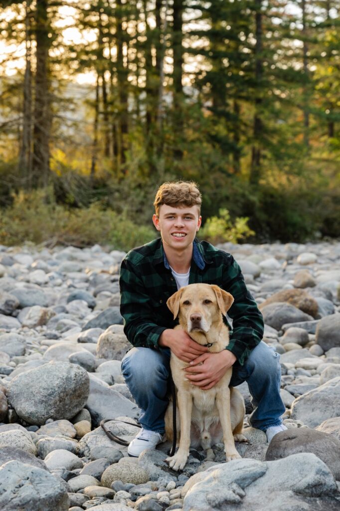 senior boy and dog river