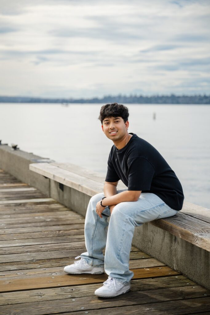 senior guy seated pose on kirkland waterfront dock