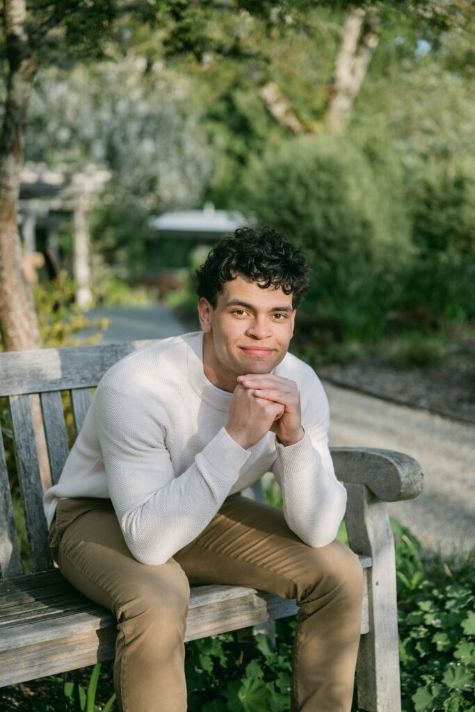senior guy sitting on bench at bellevue botanical garden